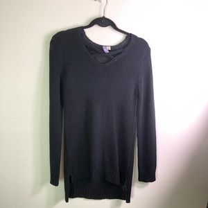 Black knit sweater with criss cross front straps